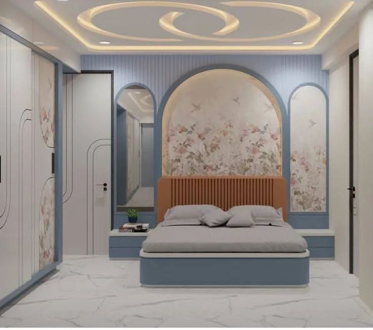 Bedroom with arched floral mural headboard and blue wardrobe